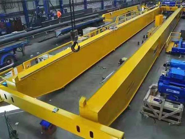 What are the preparations before the operation of a double beam crane?